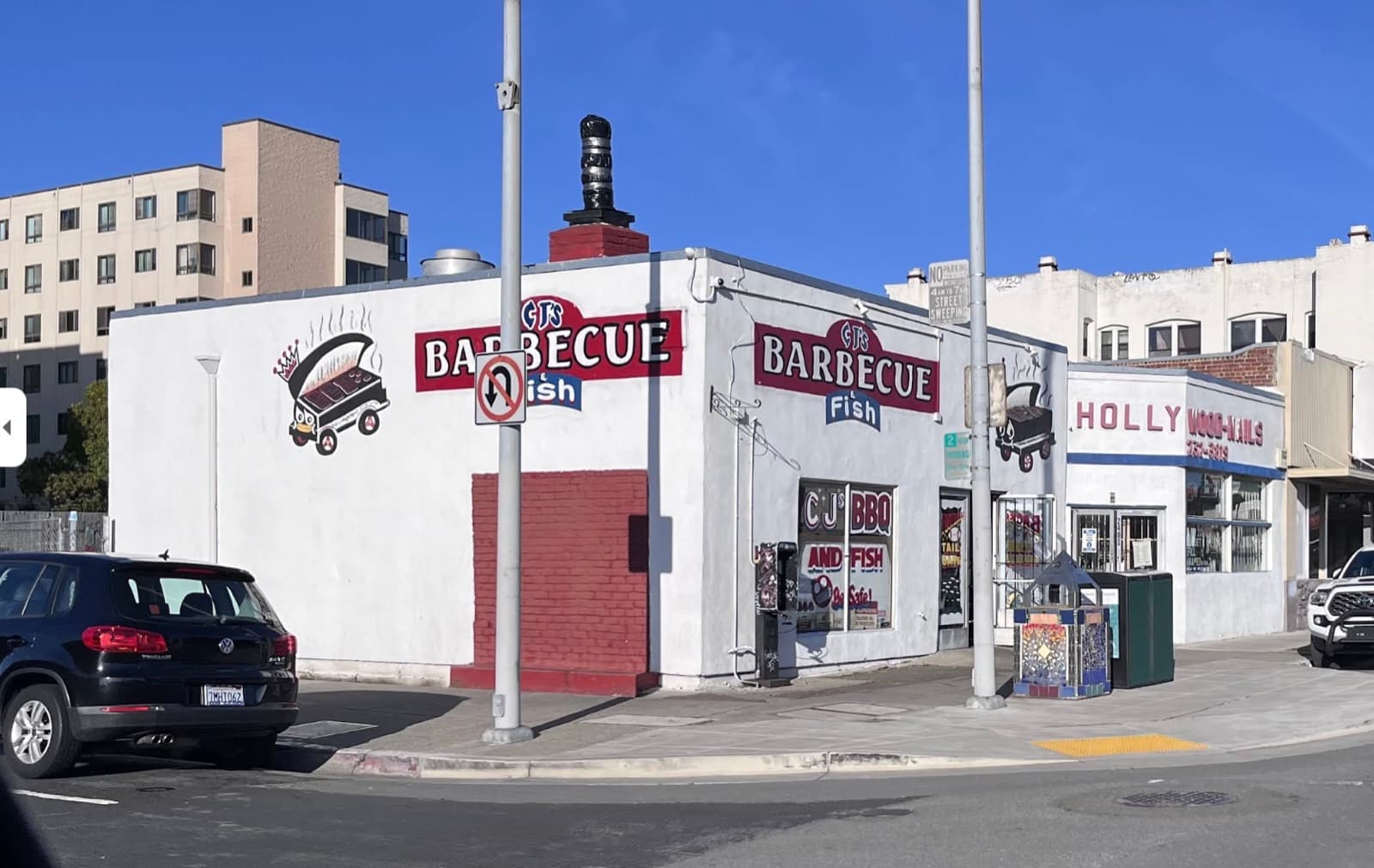 CJ's Barbecue & Fish storefront on the corner of Macdonald Ave, with its painted sign and rooftop smokestack